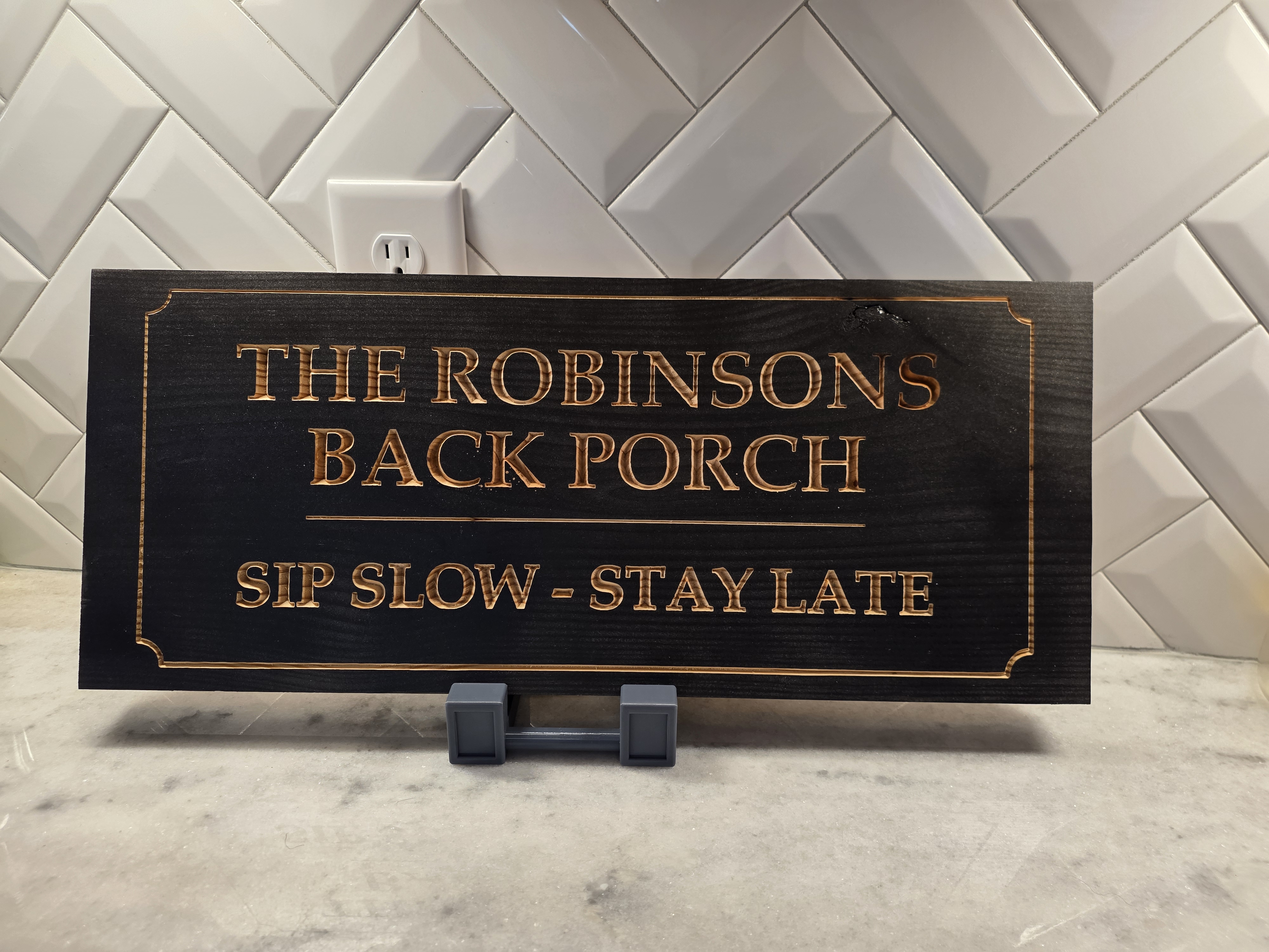 The Robinsons Back Porch Sip Slow Stay Late Ebonized Sign with Carved Natural Wood Lettering