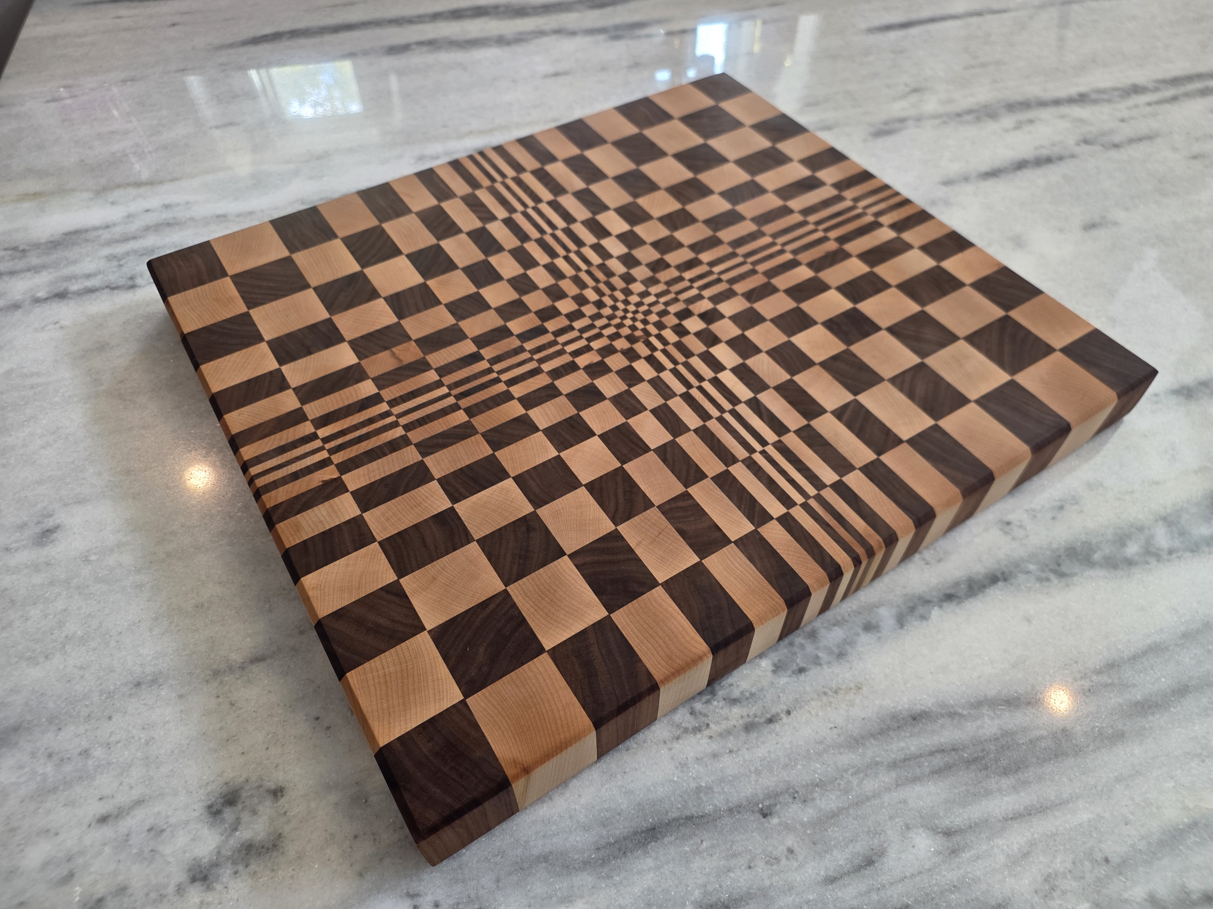 3D Optical Warp End-Grain Cutting Board in Hard Maple and Black Walnut on Marble Island